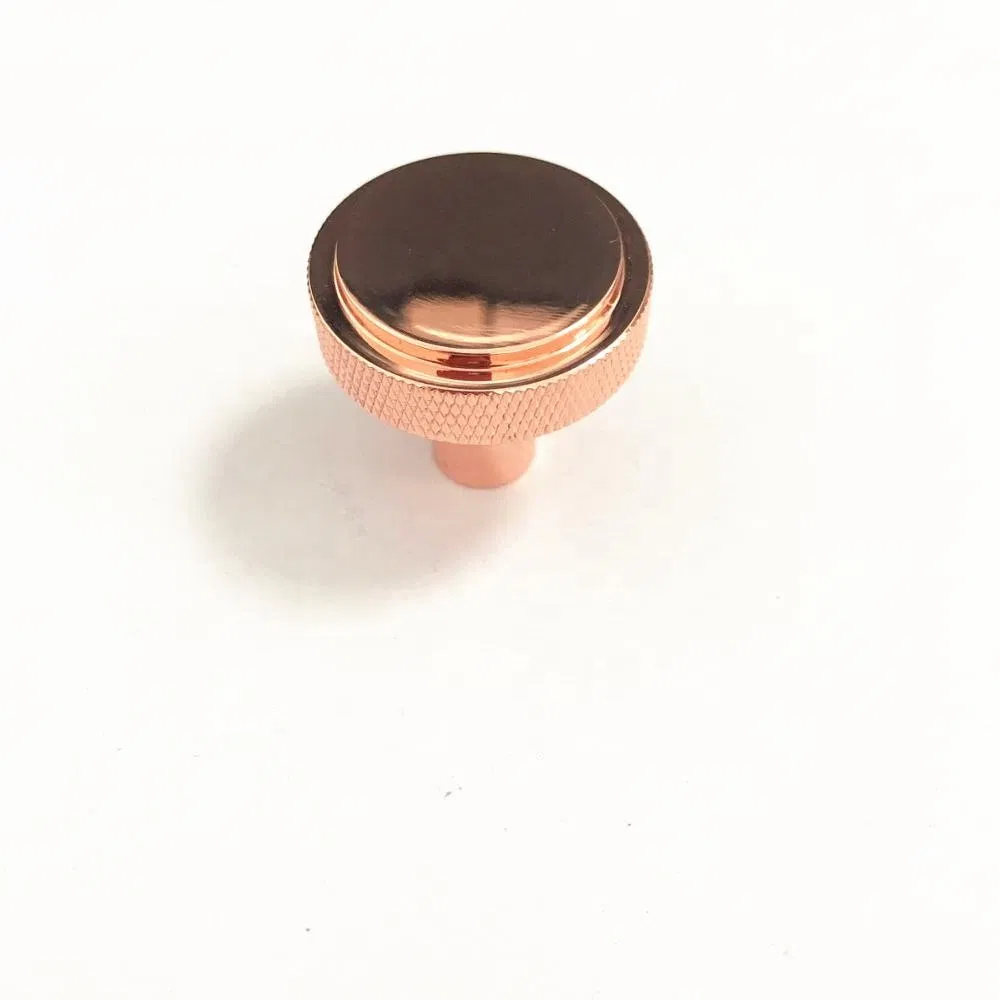 de los muebles de cocina Perilla redonda de oro rosa Textura de la puerta del armario del caj&oacute;n de los muebles de cocina Perilla redonda de oro rosa Textura 